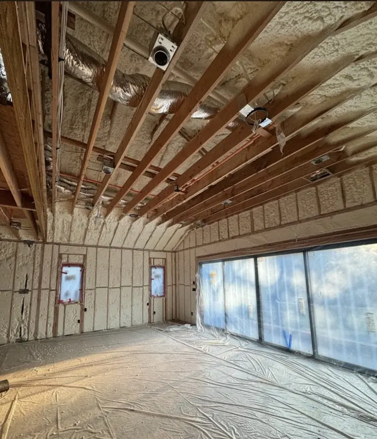 Interior walls and ceiling insulated with spray foam during new construction in Wyoming